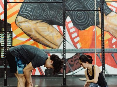 Blurry motion of a man performing a functional exercise.
