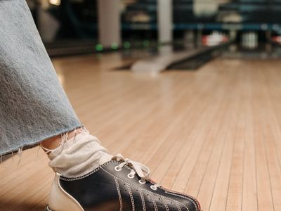 Close up of sports equipment on a wooden floor.